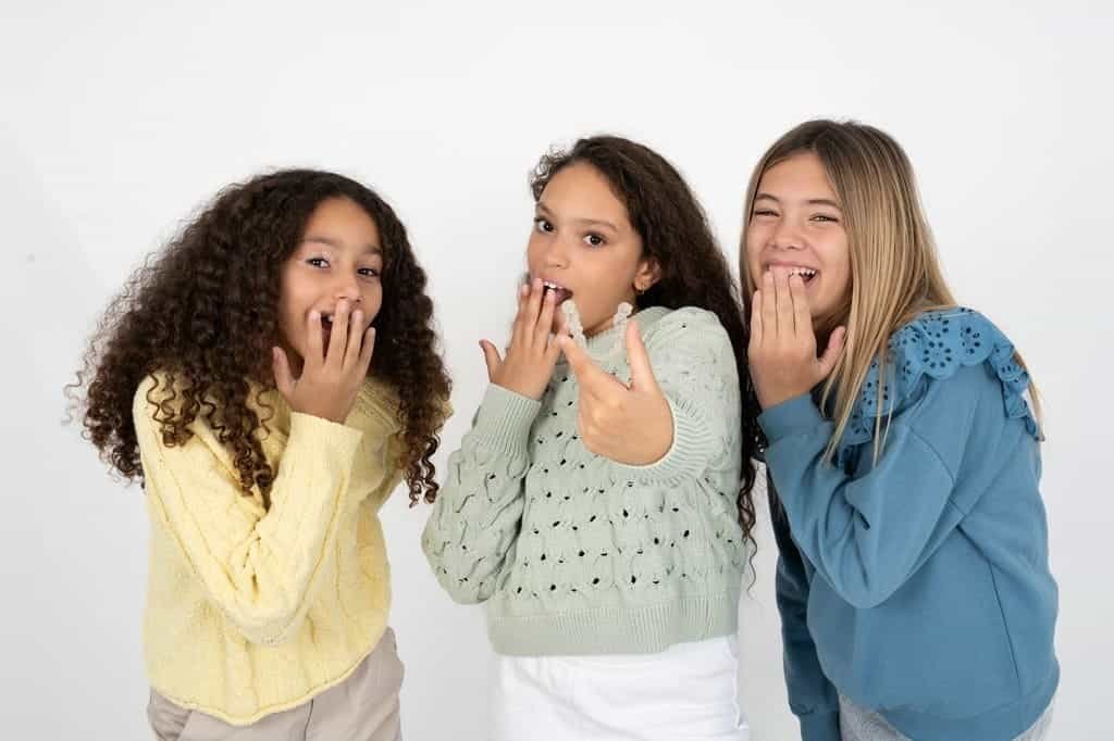 Kids using Invisalign clear aligners
