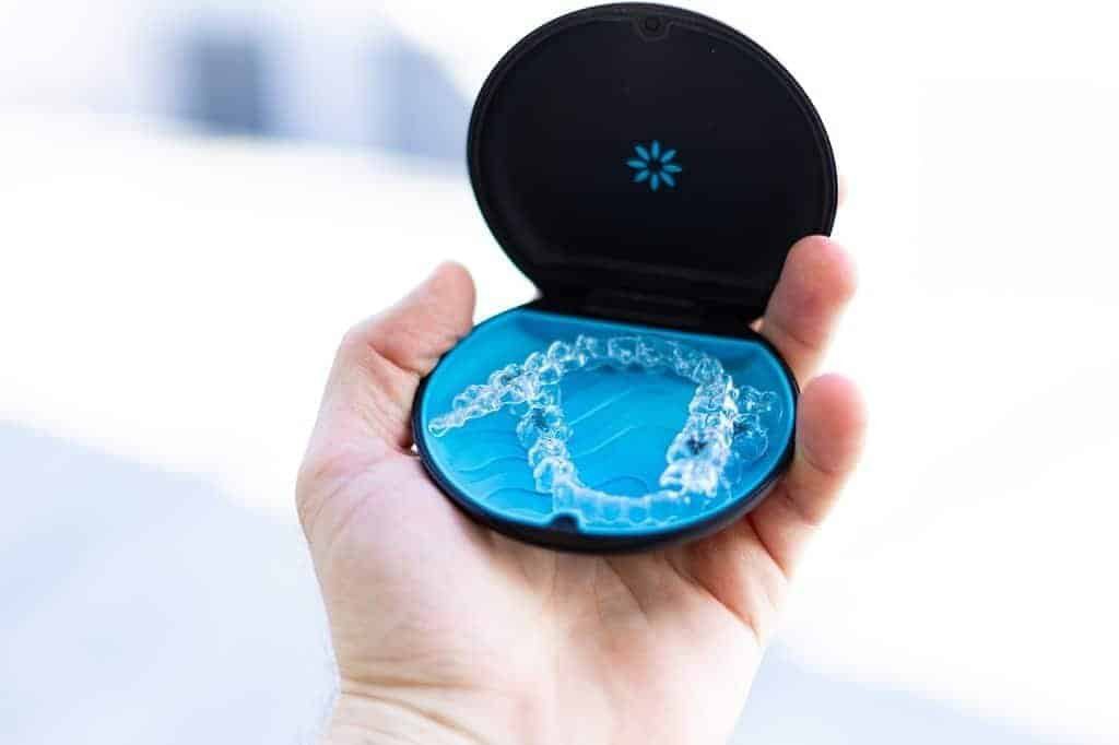Clear aligners displayed in a blue case